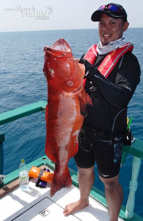 Din-poses-with-a-nice-Coral-Trout-he-caught-by-jigging