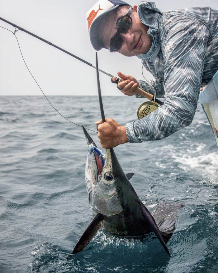 Shono San posing for a quick picture with his first Rompin sailfish on fly